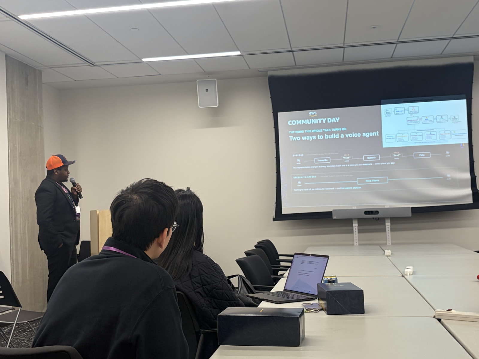 Wanjohi Christopher presenting the slide “Two ways to build a voice agent” at AWS Community Day DMV 2026, Amazon HQ2